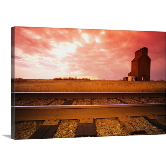 Great BIG Canvas | "Railroad Track And Grain Elevator" Canvas Wall Art - 36x24