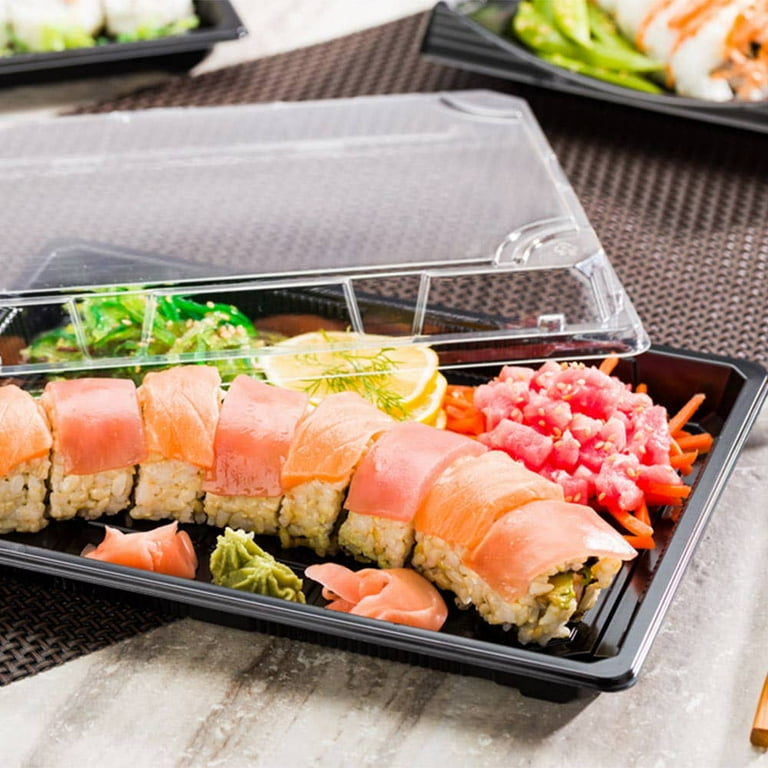 Assortment of sushi roll set on a black tray. Japanese food. Top