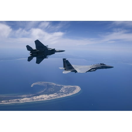 Two F-15 Eagles from the Massachusetts Air National Guard fly high over Cape Cod during a training mission Poster