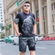 thumbnail image 5 of Camiseta lisa de hombre de talla 5xl, chándal elástico, novedad en trajes deportivos, conjuntos de pantalones cortos gráficos, Kpop, poliéster, holgado, talla XL, 5 of 5