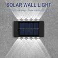 thumbnail image 4 of Apliques solares de pared (paquete de 2) | Lámparas LED exteriores con iluminación hacia arriba y hacia abajo | Apliques solares impermeables para patio, jardín, camino y entrada, 4 of 5