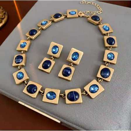 Pierced matte gold square and blue stone necklace and earring set
