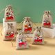 thumbnail image 2 of 6 piezas de cascabeles de Papá Noel con forma de alce y cordón de oso pequeño, bolsa de yute natural, bolsa de regalo de lino y algodón de 10 x 15 cm, bolsa de regalo con estampado navideño, 2 of 5