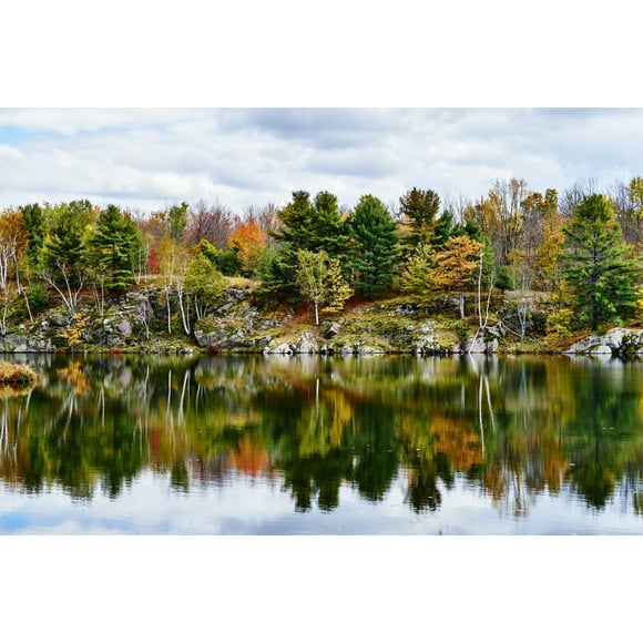 Autumn coloured foliage and clouds in Frontenac Provincial Park reflected in tranquil water; Ontario, Canada by Spencer Robertson / Design Pics (19 x 12)