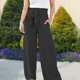 thumbnail image 4 of Pantalones Elegantes Pantalones plisados ​​cómodos de lino de algodón Traje de dama de oficina de estilo bohemio suelto para damas Ygjytge para Mujer Negro T XXL, 4 of 7
