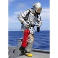 thumbnail image 2 of Firefighter carries a CO2 fire extinguisher onto the flight deck of USS Denver Poster Print, 2 of 2