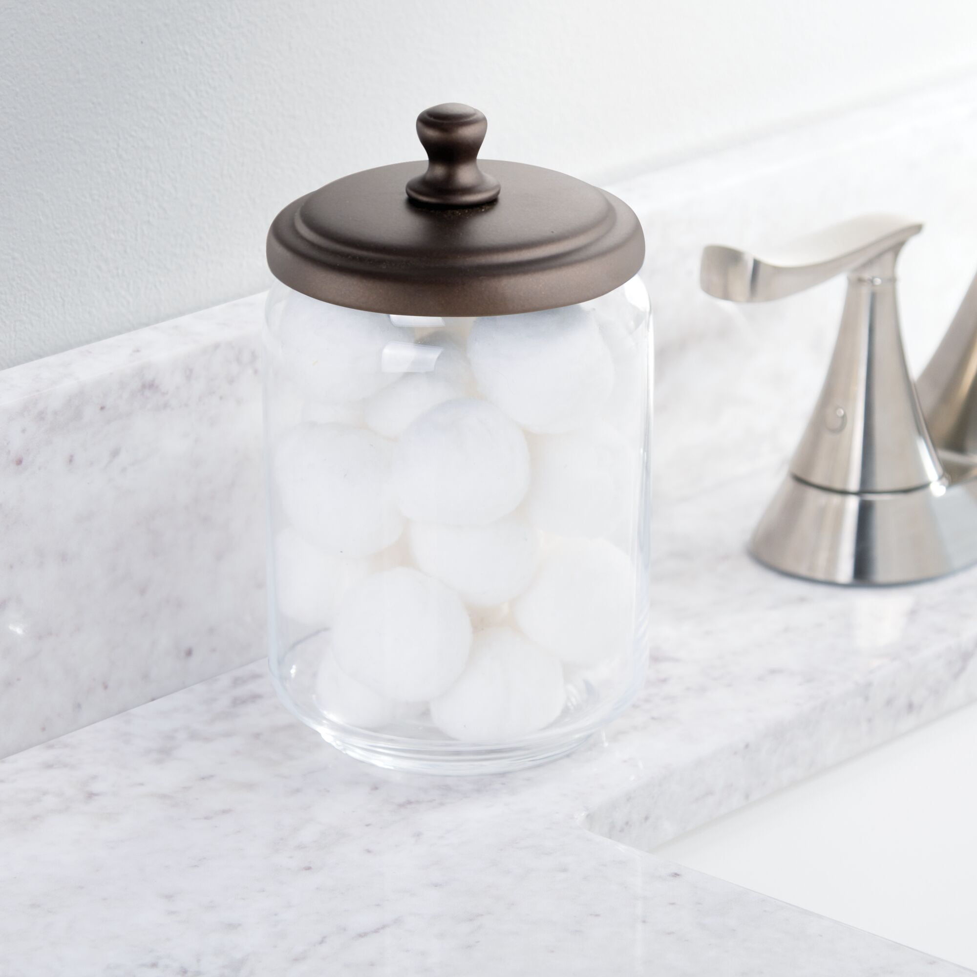 mDesign Modern Round Bathroom Vanity Countertop Storage Organizer Canister Jar Set for Cotton Swabs Bath Salts Small/Medium/Large Makeup Sponges Balls Rounds Bronze/Clear Set of 3 