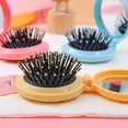 thumbnail image 5 of Folding Hair Brush with Mirror, Round Portable Mini Pop Up Pocket Hair Brush Compact Travel Size Massage Comb for Women Girls Wet and Dry Hair, 5 of 7