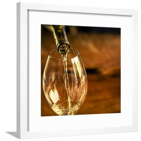 USA, Washington State, Seattle. White wine pouring into glass in a Seattle winery. Framed Print Wall Art By Richard