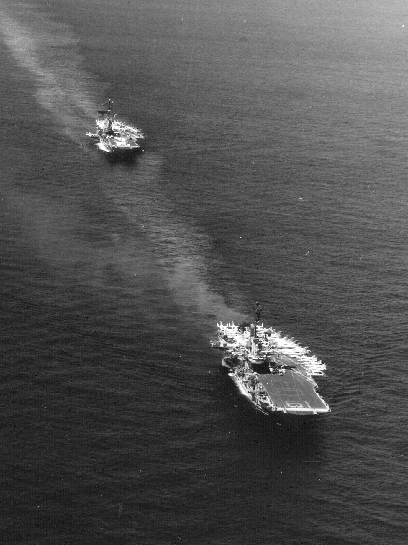 The U.S. Navy aircraft carriers USS Ticonderoga (CVA14), aft, and USS