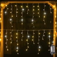 thumbnail image 4 of Cortina de luces LED con forma de carámbano para Navidad, para exteriores, 4 m (ancho) x 0,6 m (alto), luces de cadena de hadas con destellos blancos, alambre transparente, decoraciones de Año Nuevo, 4 of 5