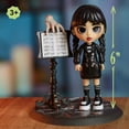 thumbnail image 6 of Wednesday Deluxe 6-inch Articulated Figure, 11-pieces, Interchangeable Face Plates and Fashion, Customizable Collectible Figurine, Kids Toys for Ages 3 Up, 6 of 9