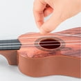 thumbnail image 3 of Meggemo Gift 16.1 Inch Simulation Ukulele Toy - Four-String Playable Small Guitar, Early Education Music Instrument for Creative Exploration, 3 of 6