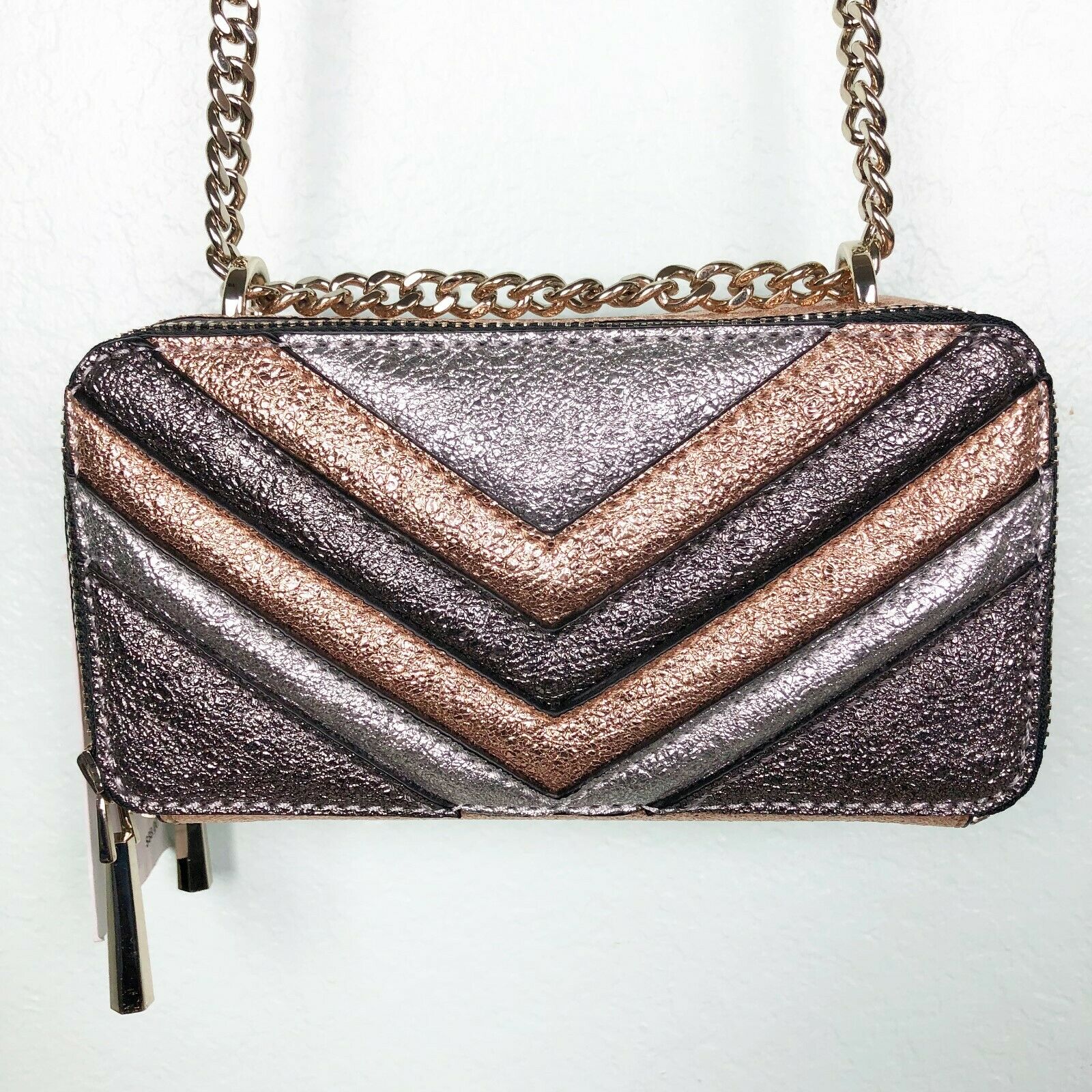 grey and rose gold purse