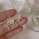 thumbnail image 4 of Pendientes de clip de oreja de rosa de Versalles para mujer, estilo hada, sin perforaciones, pendientes de té para mujer, pendientes de flor de Monet de verano, no se requiere orificio:, 4 of 6