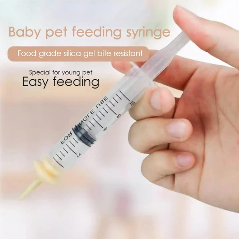 Puppy feeding syringe with teat outlet