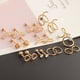 thumbnail image 3 of 10 pares de pequeños pendientes de acero inoxidable con forma de bola de cristal y aro infinito para mujer. Oro rosa, 3 of 4