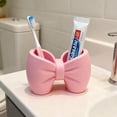 thumbnail image 3 of Plastic Bow Toothbrush Holder, 2-in-1 Countertop Pen Organizer, Nonslip Bathroom Accessory for Electric Toothbrush, Space-Saving Desk Decor for Home Office Dorm (Pink), 3 of 8