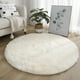 thumbnail image 1 of Una alfombra circular blanca esponjosa y linda, 1 of 2