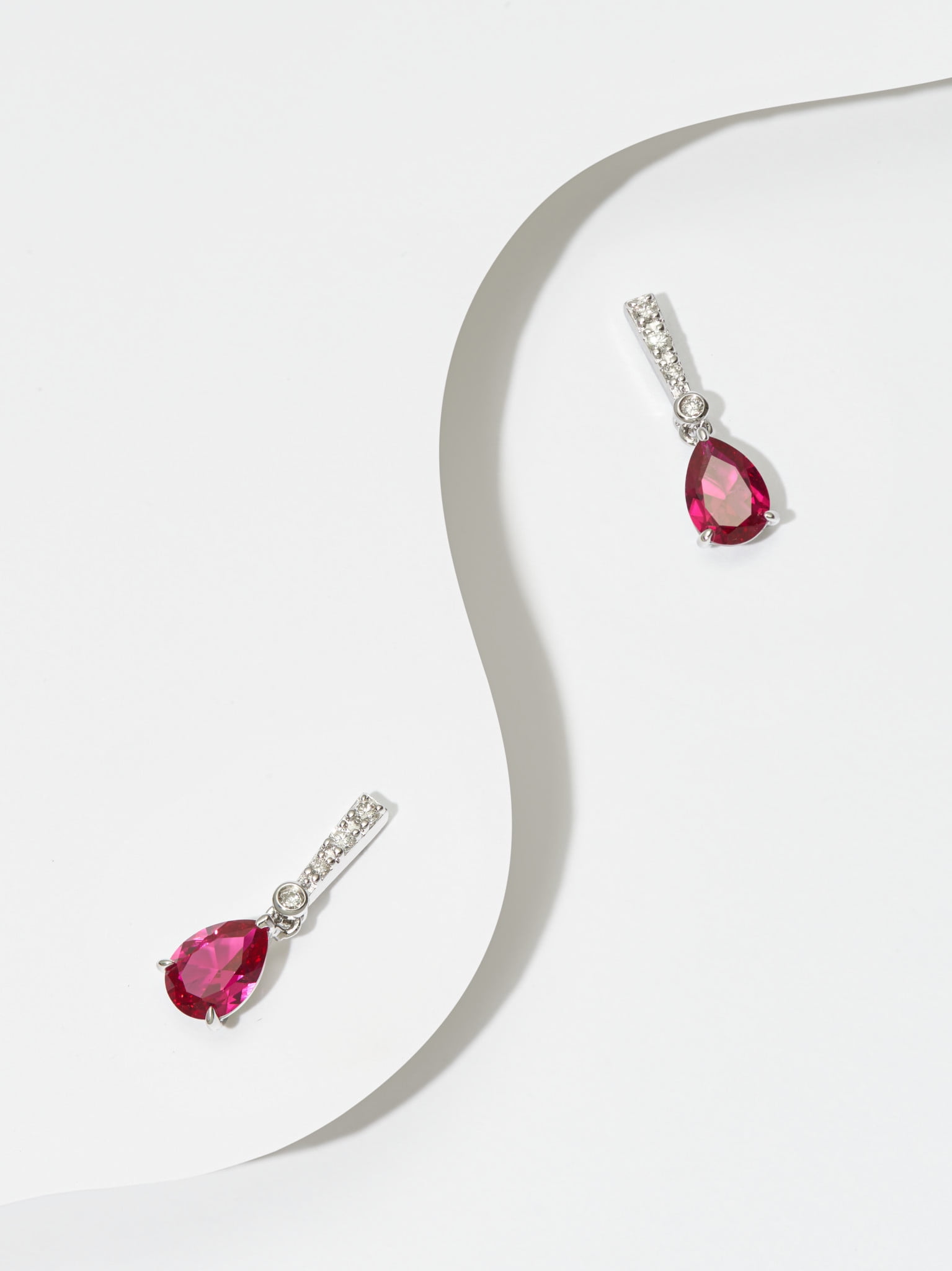 Forever Facets Jewelry Platinum Over Sterling Silver Ruby and 1/10th Carat Total Weight Lab Grown Diamond Pear Linear Tear Drop Earrings (H-I Color, I1 Clarity)