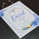 thumbnail image 2 of Pulsera Ajustable Dije de Cruz y Cristales en color azul Recuerdo Con Tarjeta Personalizada Para Bautizo, Primera Comunión, Confirmación, Boda, xv Años,etc.Paquete de 10 Piezas, 2 of 5