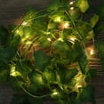 thumbnail image 1 of Guirnalda de hiedra artificial con luces 6.56 Ft Vines colgantes Decoración verde falsa para el hogar de Navidad Muyoka Hogar, 1 of 2