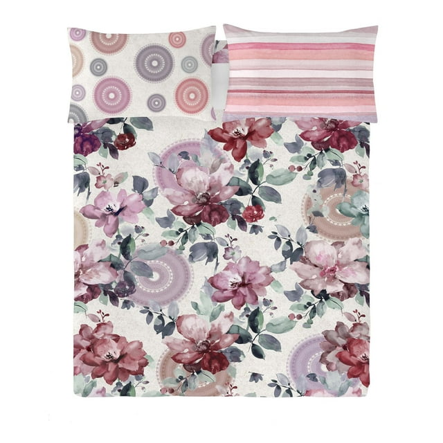 Gouchee Home Carmela reversible cotton duvet cover set featuring a floral design with pink, red, and purple flowers alongside circular motifs on one side, and pink-striped pattern pillowcases on the reverse
