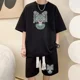 thumbnail image 3 of Chándal informal de moda de gran tamaño de verano, traje holgado para correr con diseño de gofre, camiseta holgada de manga corta y pantalones cortos deportivos, conjunto de 2 piezas para hombre, 3 of 5