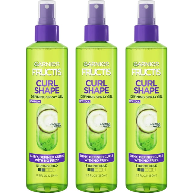 Garnier Fructis Style Curl Shape Defining Spray Gel For No Frizz, 8.5 fl oz, 3 count. The image shows three green bottles with purple spray caps, labeled 'Curl Shape Defining Spray Gel' with coconut water and strong hold features. Designed for curly hair to define curls, reduce frizz, and add shine.