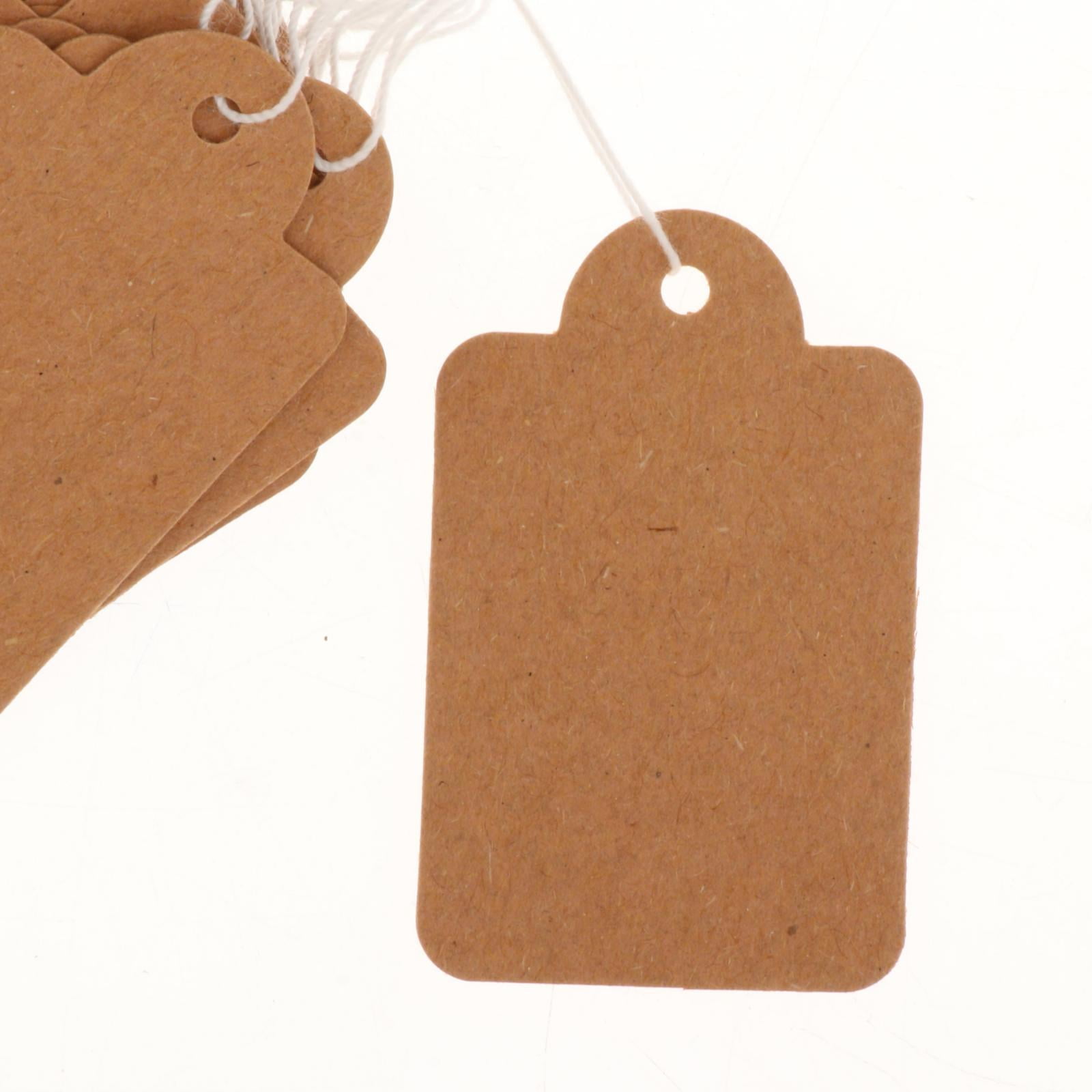 Brown craft labels. Different paper vintage blank pricing tags hanging By  YummyBuum