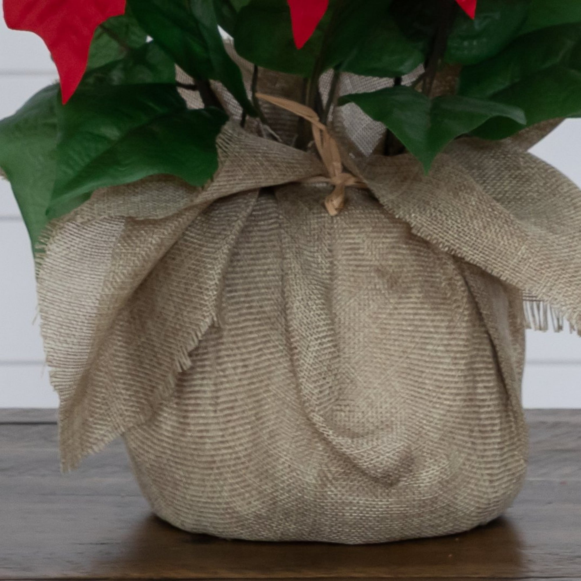 16in. Artificial Poinsettia Arrangement in Burlap Planter