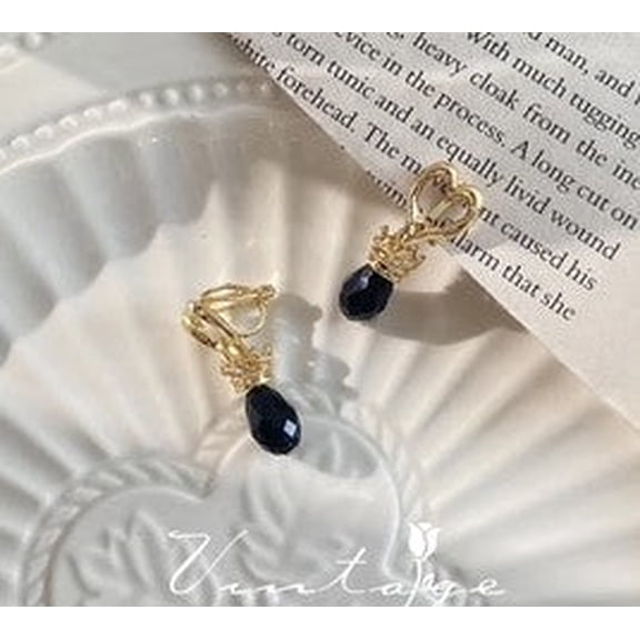 Clip on 1 1/4" gold cutout heart earrings with dangle black bead