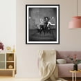 thumbnail image 3 of Historic Framed Print, [Scene from Act II of The Old Curiosity Shop", showing young man and girl dancing on office stools around table]", 17-7/8" x 21-7/8", 3 of 9