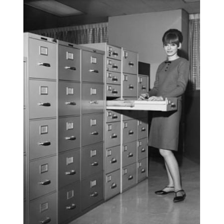 Insulated Holding Cabinet - Portrait of a businesswoman holding a document beside a filing cabinets Stretched Canvas - (24 x 36)