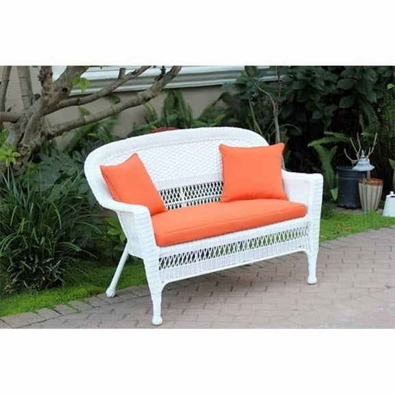 White Wicker Patio Love Seat With Orange Cushion And Pillows