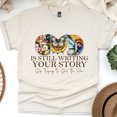 thumbnail image 1 of God Is Still Writing Your Story Christian T-Shirt Faith Graphic Tee, Natural, Size 2XL, 1 of 6