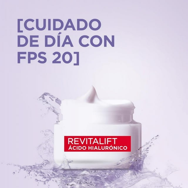 l'oréal paris kit revitalift ácido hialurónico: enfoque en la crema de día blanca con etiqueta roja 'Revitalift Ácido Hialurónico' y texto 'Cuidado de día con FPS 20' sobre fondo lila con salpicaduras de agua; el set incluye crema de día, crema de ojos y sérum (1.5% ácido hialurónico) según especificaciones del producto.