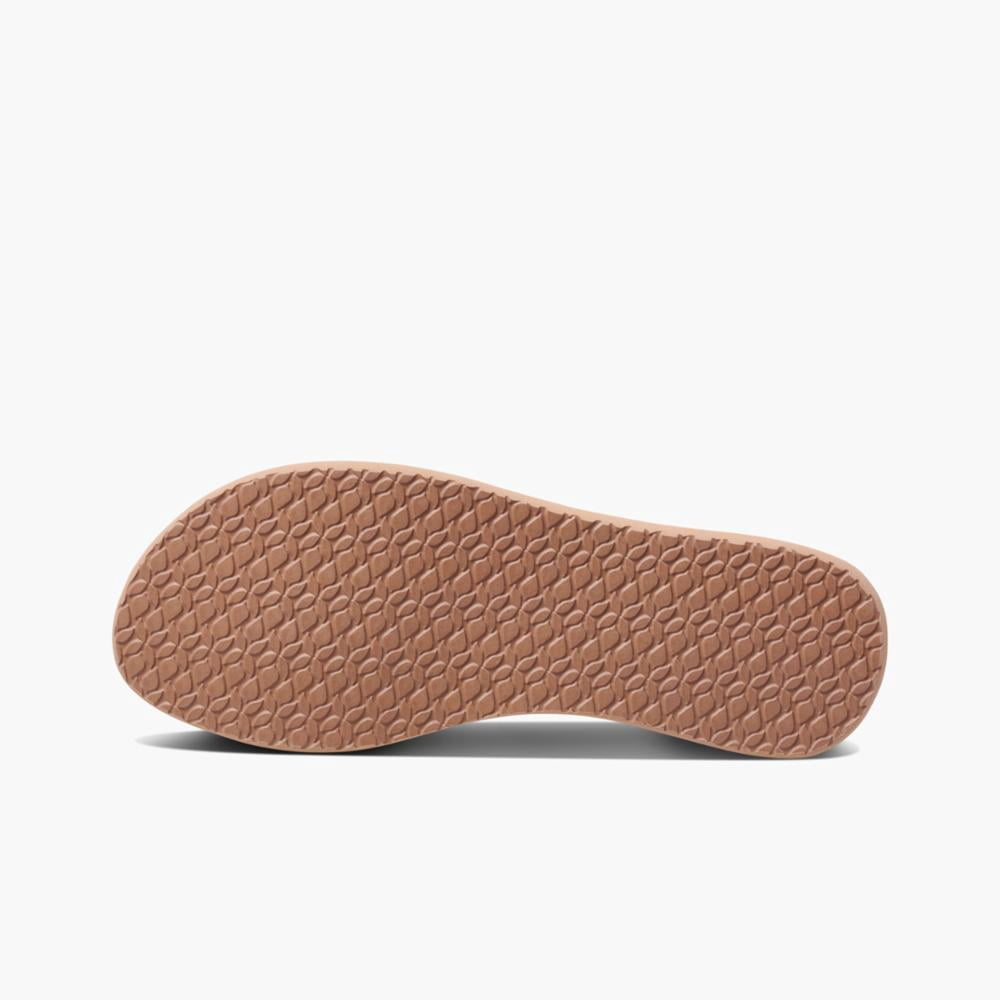 reef star cushion almond