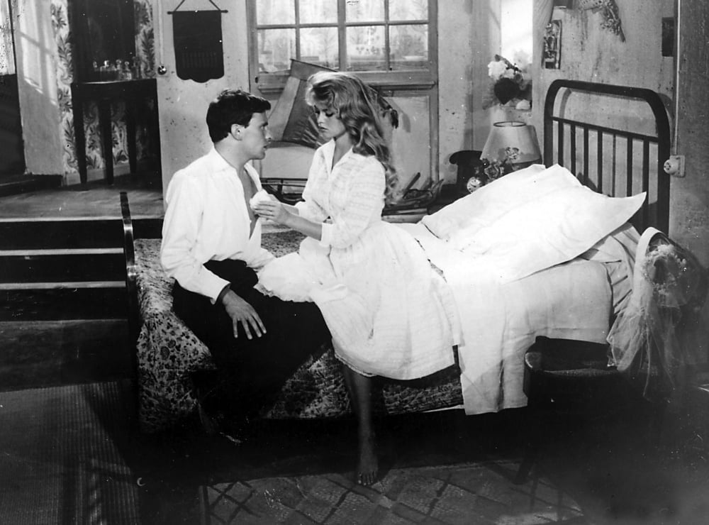 Film still featuring Brigitte Bardot and JeanLouis Trintignant in And God Created Woman Photo