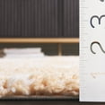 thumbnail image 4 of SAFAVIEH Rumi Derek Distressed Polyester Shag Area Rug, Gold/Ivory, 9' x 12', 4 of 7