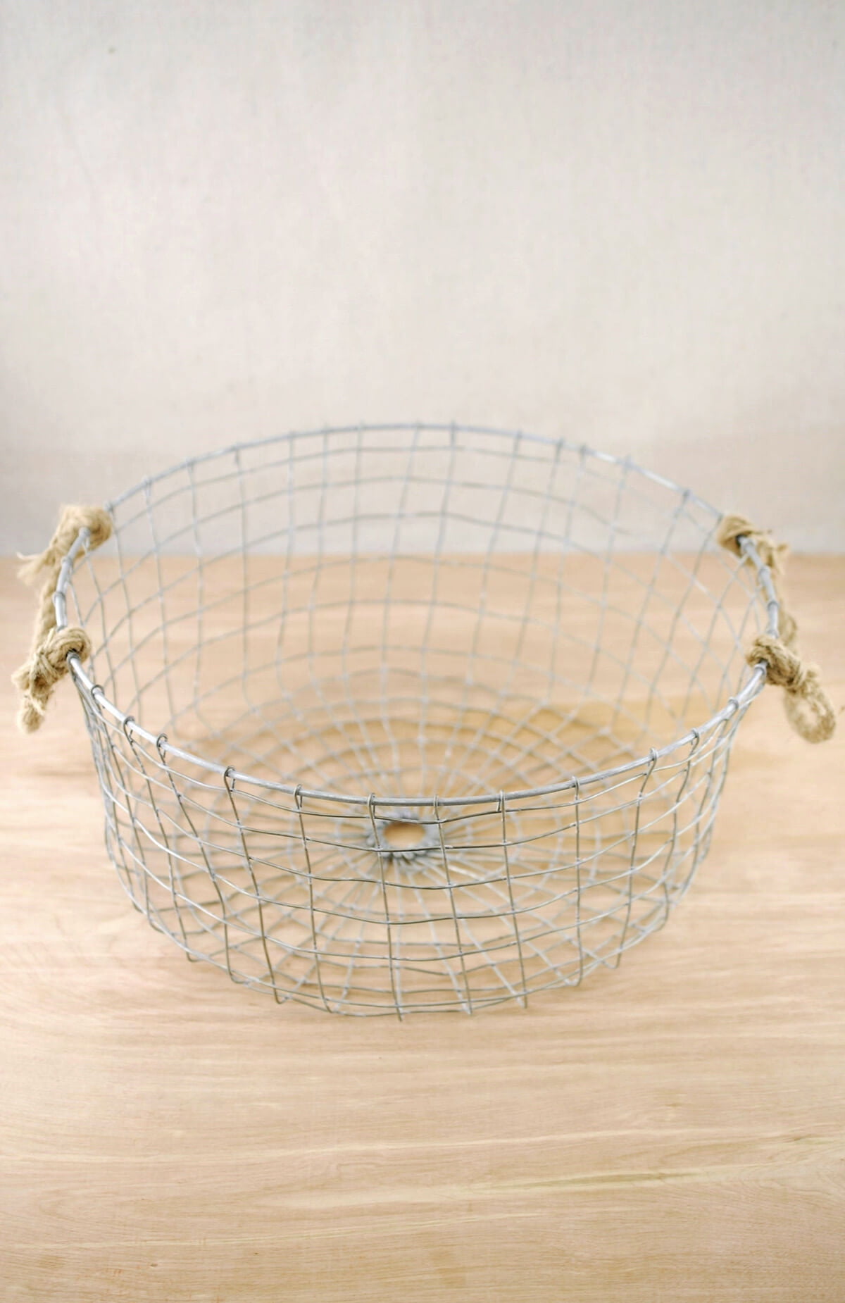 Wire Basket Round 14 x 6in. A Round Metal Wire Basket With Rope