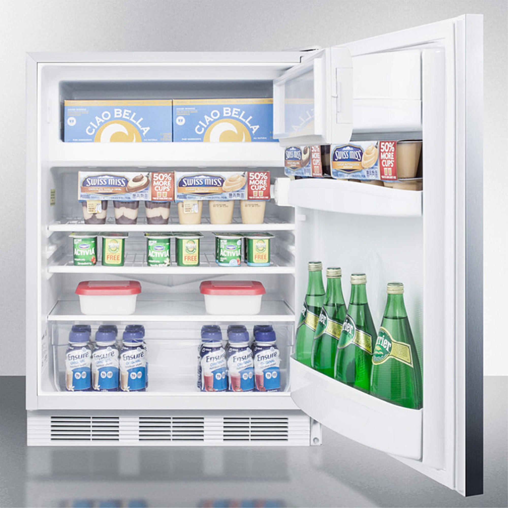 Freestanding counter height refrigerator-freezer for residential use, cycle defrost with a stainless steel wrapped door, towel bar handle, and white cabinet