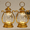 Gold, variant on Fmxomd 2Pack Mini Lantern Decor 6.4 Inch Western Lantern Table Centerpiece Small Vintage Camping Hanging Lamp Ornaments for Cowboy Wedding Halloween Christmas (6.4", Bronze)