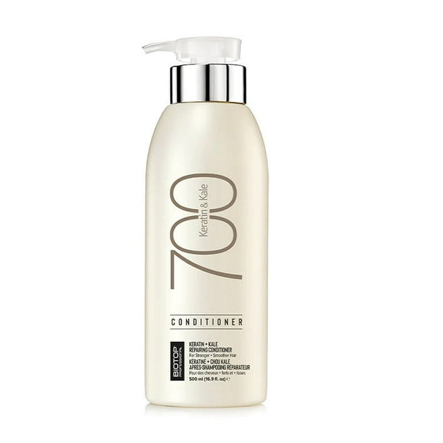 Biotop 700 Keratin + Kale Conditioner 500 ml in a sleek, beige bottle with a pump dispenser. This conditioner is designed to smooth, soften, and strengthen damaged or frizzy hair. Infused with keratin protein and kale extract, it helps repair split ends, restore moisture, and enhance shine. The bottle features bold '700' branding and product details in elegant typography.