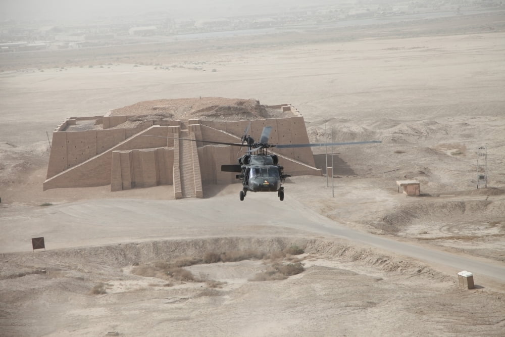 A Us Army Black Hawk Helicopter Hovers Above The Ancient Ziggurat Of Ur 