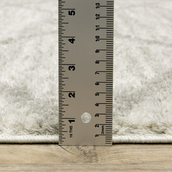 HomeRoots 2' X 8' Ivory And Grey Geometric Shag Power Loom Stain Resistant Runner Rug