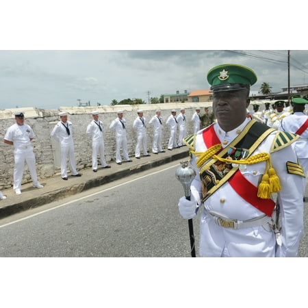 LAMINATED POSTER Members of the Trinidad and Tobago Defense Force marching band, foreground, perform during the reded Poster Print 24 x