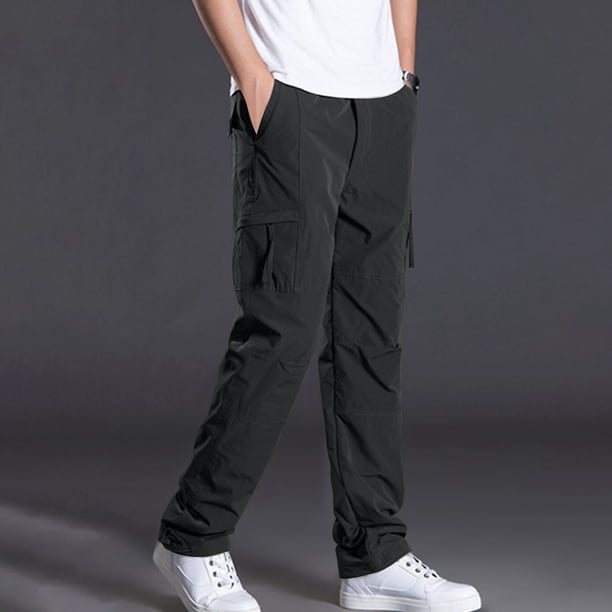 Pantalones largos de poliéster para hombre, de color liso, informales, con botones, cintura elástica y múltiples bolsillos.