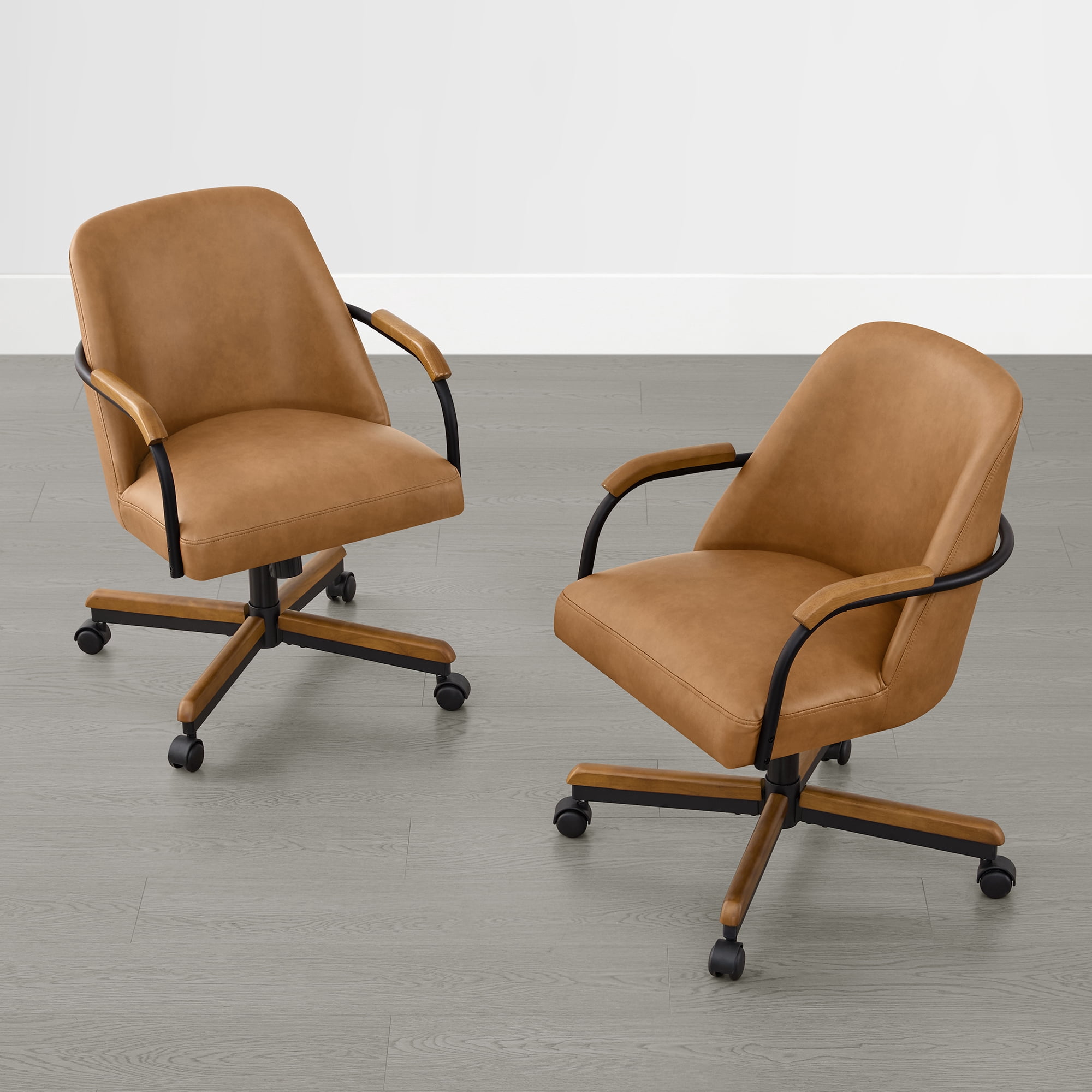 Spruce & Spring Swivel Dining Chairs Set of 2, Upholstered Tilt Chairs with Caster Wheels, Metal Frame & Wood Accents, for Dining Room, Kitchen & Home Office, Brown Faux Leather