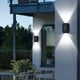 thumbnail image 1 of Lámpara solar de pared con iluminación hacia arriba y hacia abajo para exteriores, IP65, decoración moderna para el hogar, jardín, porche, color negro, paquete de 2 unidades., 1 of 9